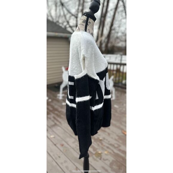 Oversized, cold shoulder, black and white fuzzy sweater. - Picture 7 of 12